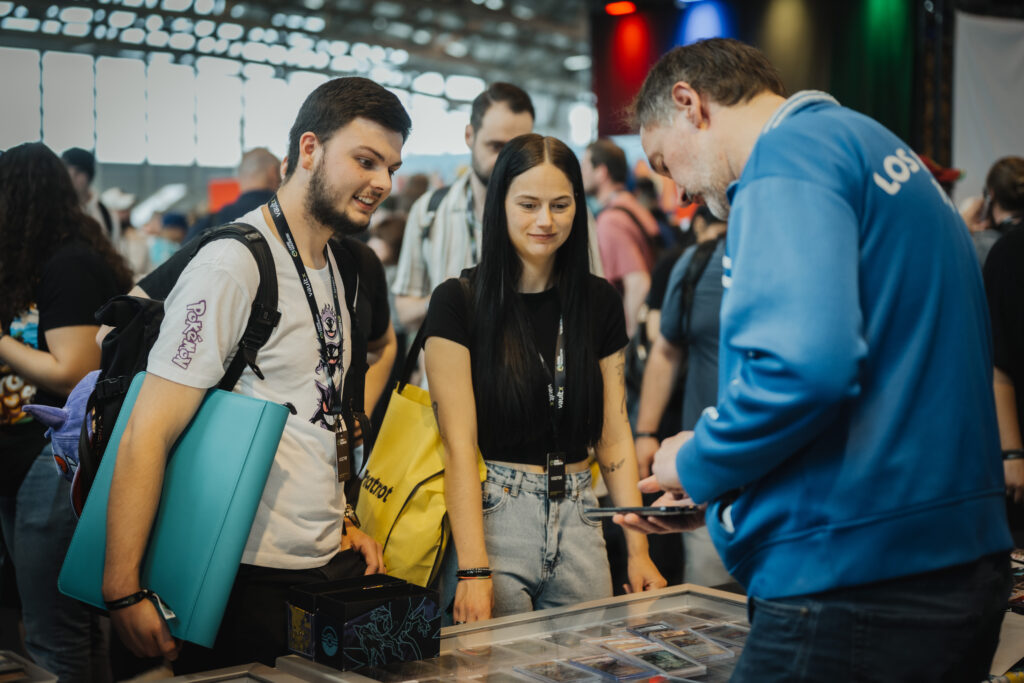 Visitors gathering at a trading card booth in the CARDMADNESS hall